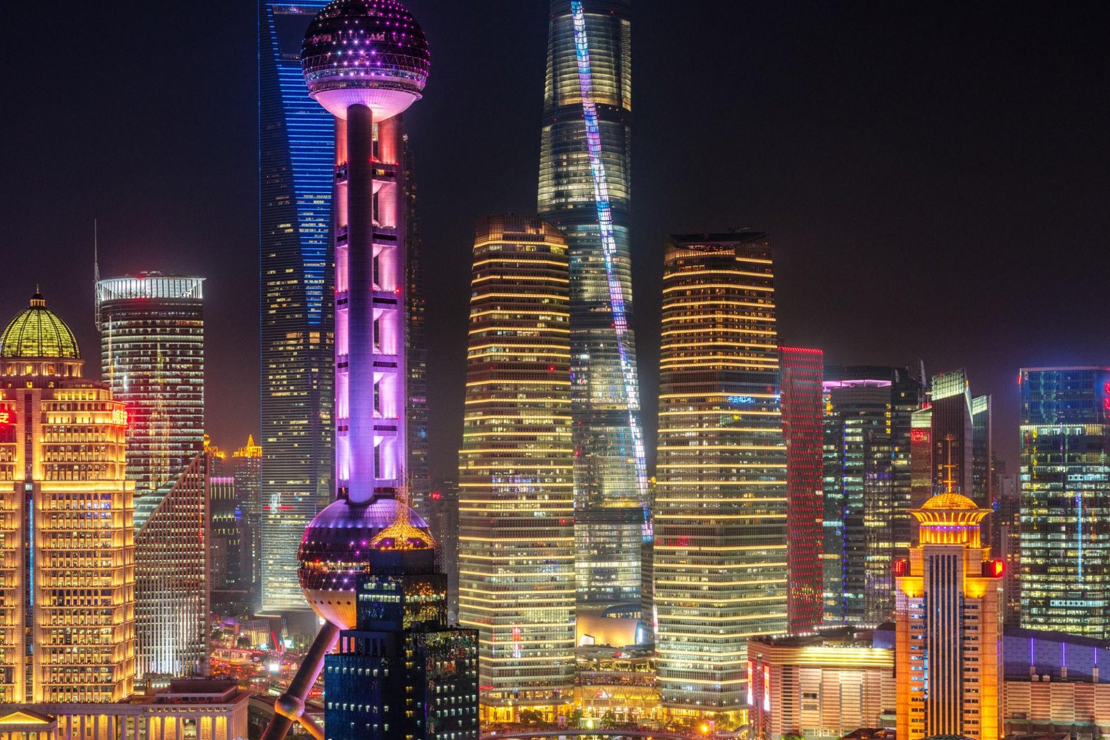 Shanghai skyline at night with Oriental Pearl Tower and city lights